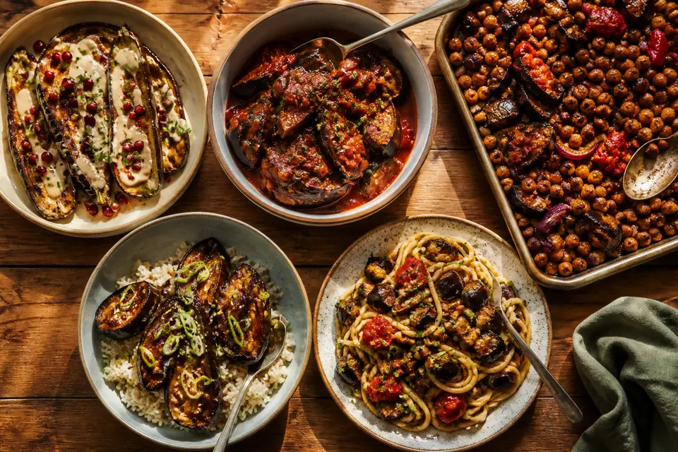 Five aubergine centred dinners on a warm table