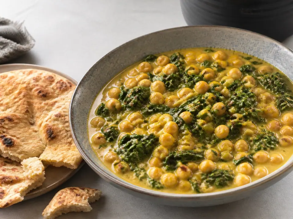 Coconut chickpea curry with greens and warm flatbread