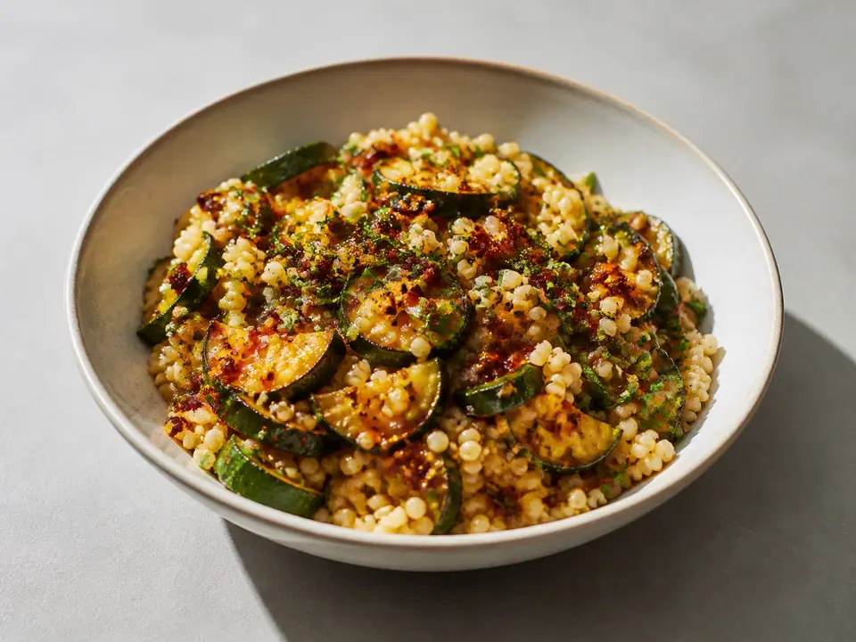 Courgette almond couscous with sesame chilli oil