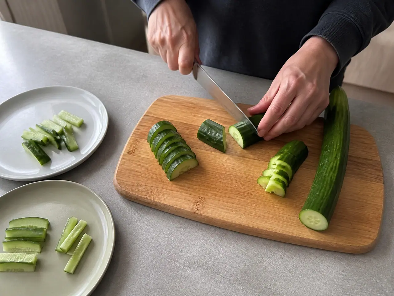 Hands slicing English and salad cucumbers for a crunch test