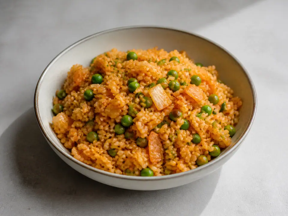 Kimchi fried rice with peas and fresh sesame oil and spring onions