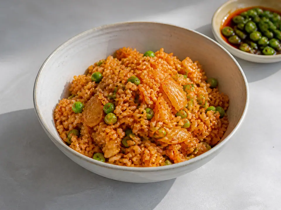 Kimchi fried rice with peas and sesame chilli oil