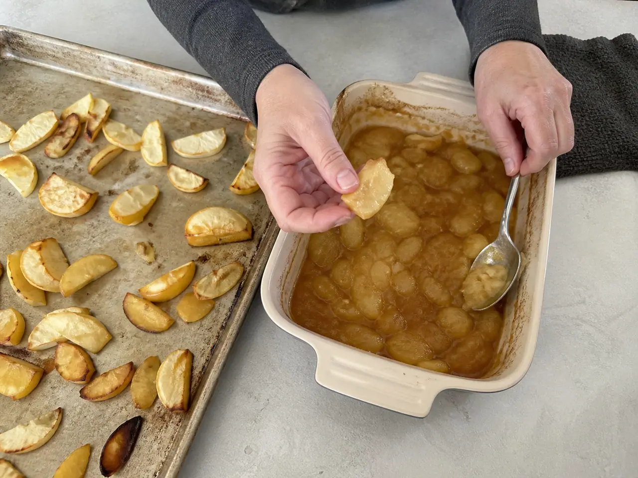 Hands testing apple slices at different stages of baking