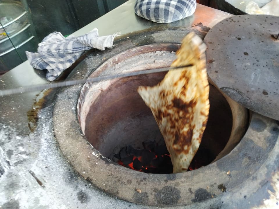 Flatbreads cooking in a pan